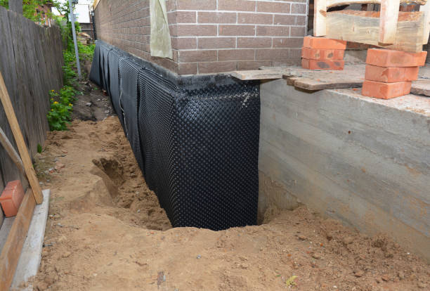 Happy homeowners after waterproofing job in Waterport